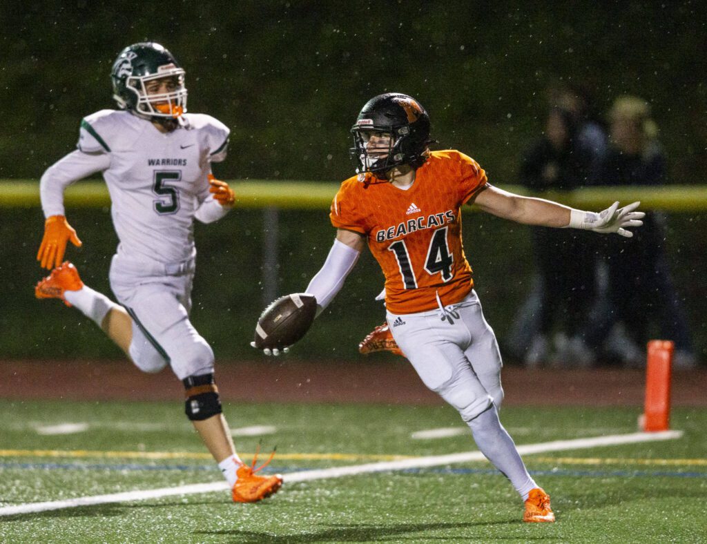 Monroe’s Ryan Miller runs the ball into the end zone for a touchdown during the game against Edmonds-Woodway on Friday, Oct. 13, 2023 in Monroe, Washington. (Olivia Vanni / The Herald)
