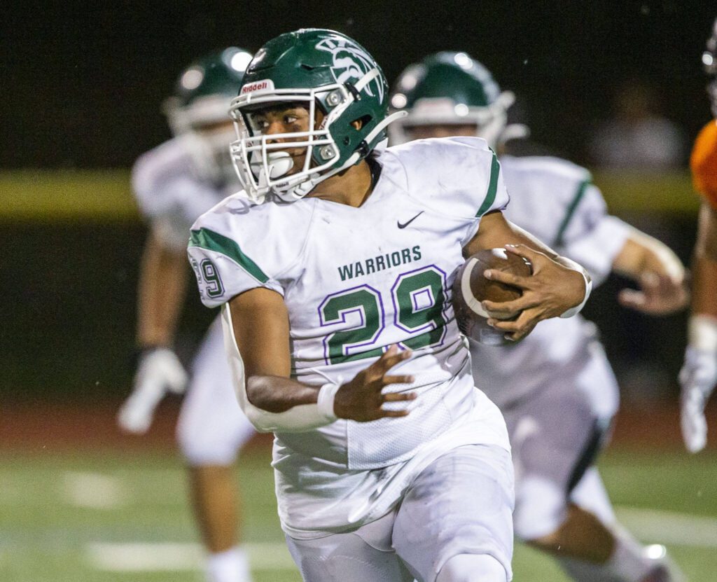 Edmonds-Woodway’s Rashad Gerona-Chatters runs the ball during the game against Monroe on Friday, Oct. 13, 2023 in Monroe, Washington. (Olivia Vanni / The Herald)
