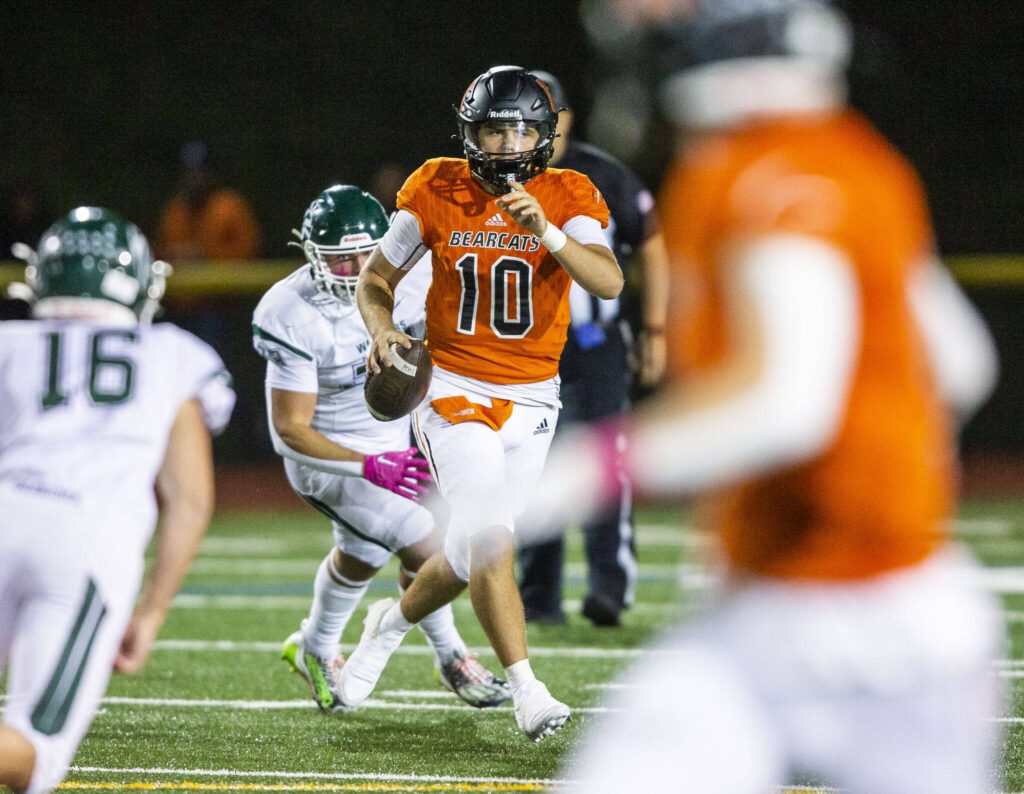 Monroe’s Blake Springer directs teammates to get open while he scrambles to pass the ball during the game against Edmonds-Woodway on Friday, Oct. 13, 2023 in Monroe, Washington. (Olivia Vanni / The Herald)
