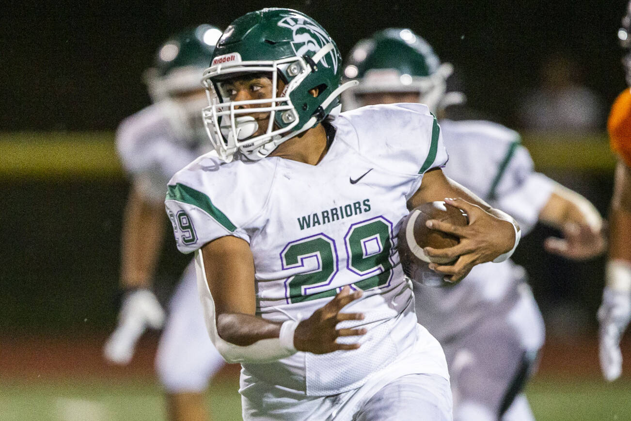 Edmonds-Woodway's Rashad Gerona-Chatters runs the ball during the game against Monroe on Friday, Oct. 13, 2023 in Monroe, Washington. (Olivia Vanni / The Herald)