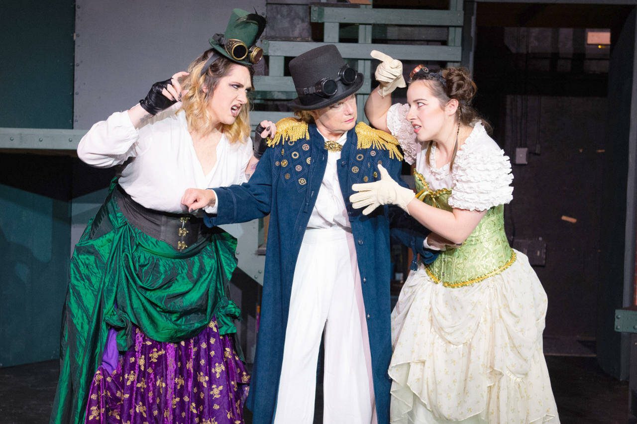Sisters Avery (Briar Scott), left, and Rowan (Grace Madland), right, argue as their mother, Lier (Brynne Garman), tries to keep them apart in “Ripeness Is All” at the Red Curtain Arts Center in Marysville. (Kenny Randall)