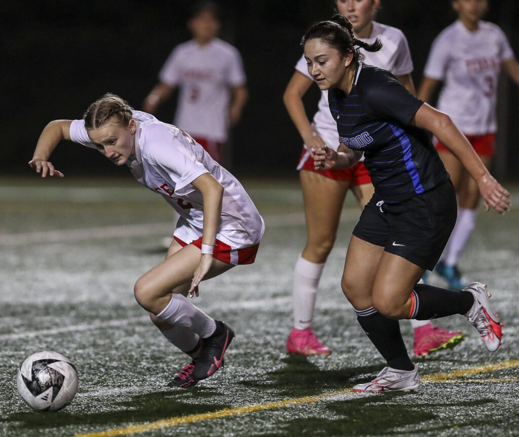 Shorewood’s Liah Nottingham (9) and Mountlake Terrace’s Chloe Parker (22) fight for the ball during a soccer game between Shorewood and Mountlake Terrace at Shorewood Stadium in Shoreline, Washington on Thursday, Oct. 19, 2023. Shorewood won, 4-0. (Annie Barker / The Herald)

