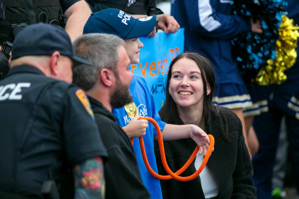 Carson’s mother, Amey Leach, beams as she takes a photo with her son at a surprise Make-A-Wish sendoff Saturday, Oct. 21, 2023, at Thornton A. Sullivan Park in Everett, Washington. (Ryan Berry / The Herald)
