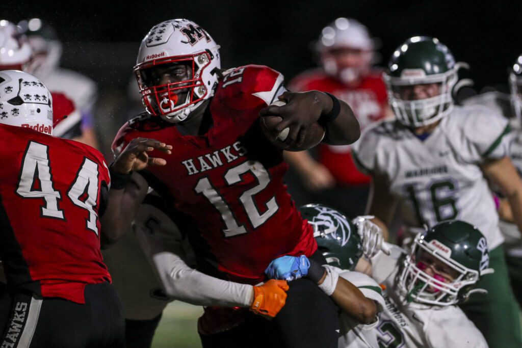 Mountlake Terrace’s Zaveon Jones (12) moves with the ball during a game between Edmonds-Woodway and Mountlake Terrace at Edmonds-Woodway Stadium in Edmonds, Washington on Friday, Oct. 20, 2023. Edmonds-Woodway won, 13-10. (Annie Barker / The Herald)
