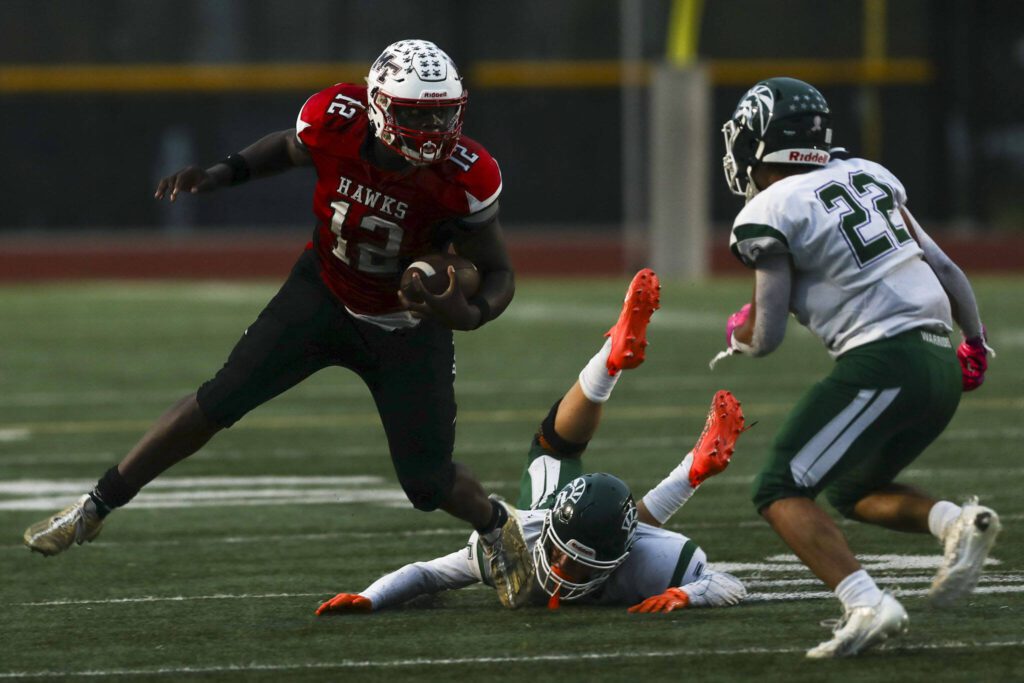 Mountlake Terrace’s Zaveon Jones (12) moves with the ball during a game between Edmonds-Woodway and Mountlake Terrace at Edmonds-Woodway Stadium in Edmonds, Washington on Friday, Oct. 20, 2023. Edmonds-Woodway won, 13-10. (Annie Barker / The Herald)
