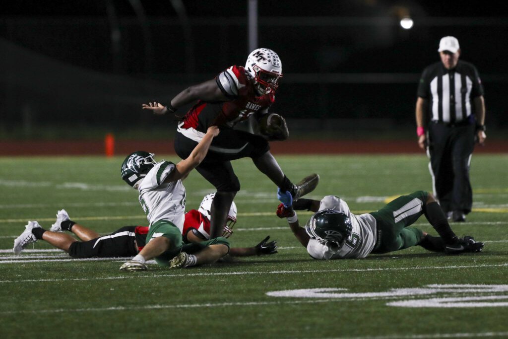 Mountlake Terrace’s Zaveon Jones (12) moves with the ball during a game between Edmonds-Woodway and Mountlake Terrace at Edmonds-Woodway Stadium in Edmonds, Washington on Friday, Oct. 20, 2023. Edmonds-Woodway won, 13-10. (Annie Barker / The Herald)
