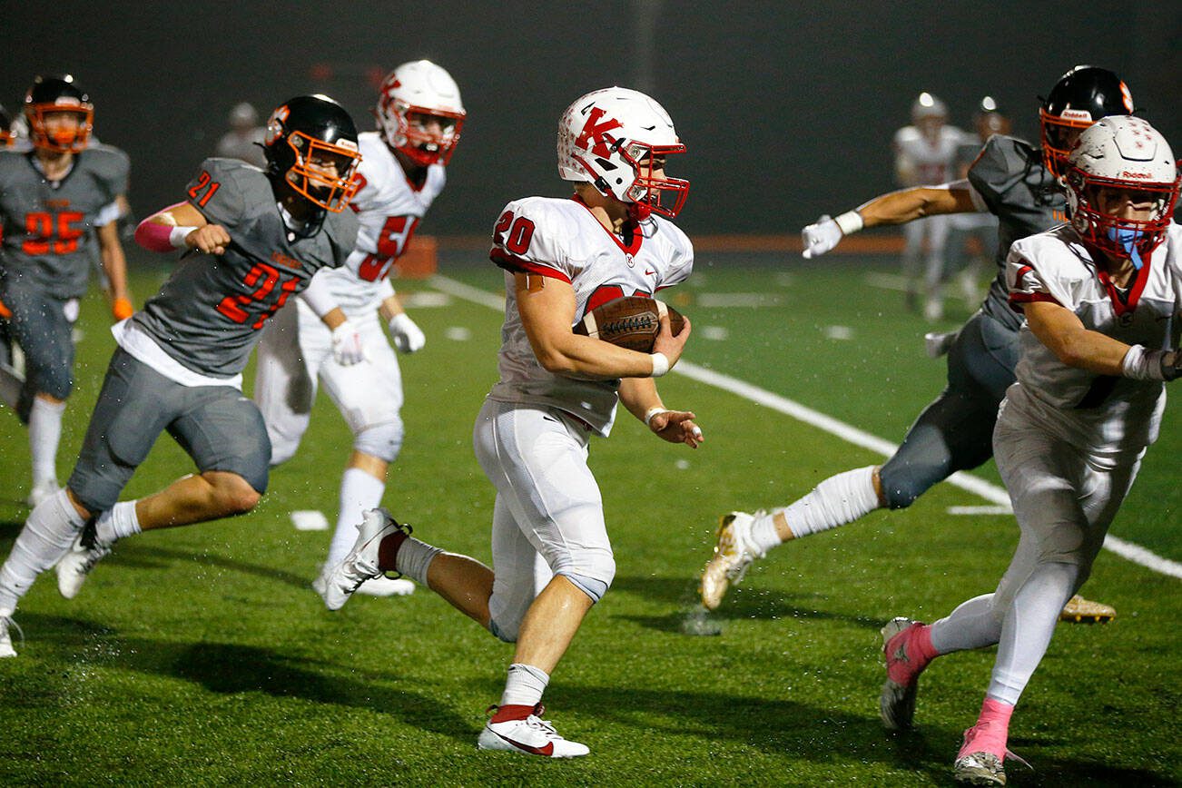 Kings junior running back Braeden Caulk weaves his way for a long touchdown run against Granite Falls on Friday, Oct. 20, 2023, at Granite Falls High School in Granite Falls, Washington. (Ryan Berry / The Herald)