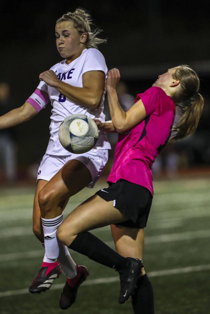 Lake Steven’s Zoe Hopkins (8) and Kamiak’s Ashlyn Brynelson (18) collide during a game between Lake Stevens and Kamiak at Kamiak High School in Mukilteo, Washington on Monday, Oct. 23, 2023. Lake Stevens won, 4-2. (Annie Barker / The Herald)
