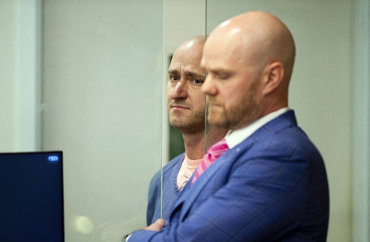 Joseph David Emerson, left, 44, is arraigned Tuesday in Multnomah County Circuit Court in Portland, Ore. Emerson, a pilot, is accused of attempting to disable the engines of a plane on which he was riding while off-duty on Sunday evening. Emerson pleaded not guilty Tuesday. (Dave Killen/The Oregonian via AP, Pool)