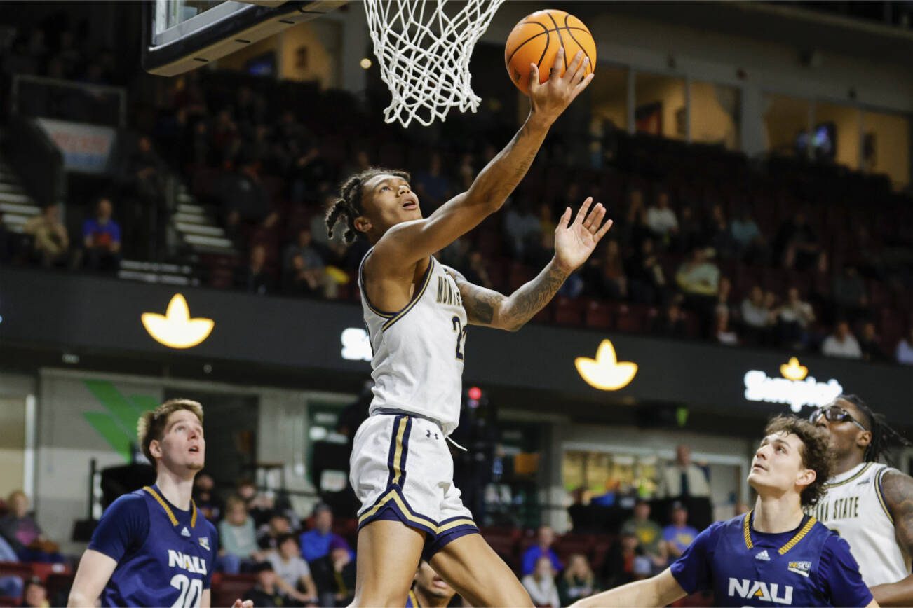 Montana State guard RaeQuan Battle (21) lays the ball up for a basket against Northern Arizona in the first half of an NCAA college basketball game for the championship of the Big Sky men's tournament in Boise, Idaho, Wednesday, March 8, 2023.  (AP Photo/Steve Conner)