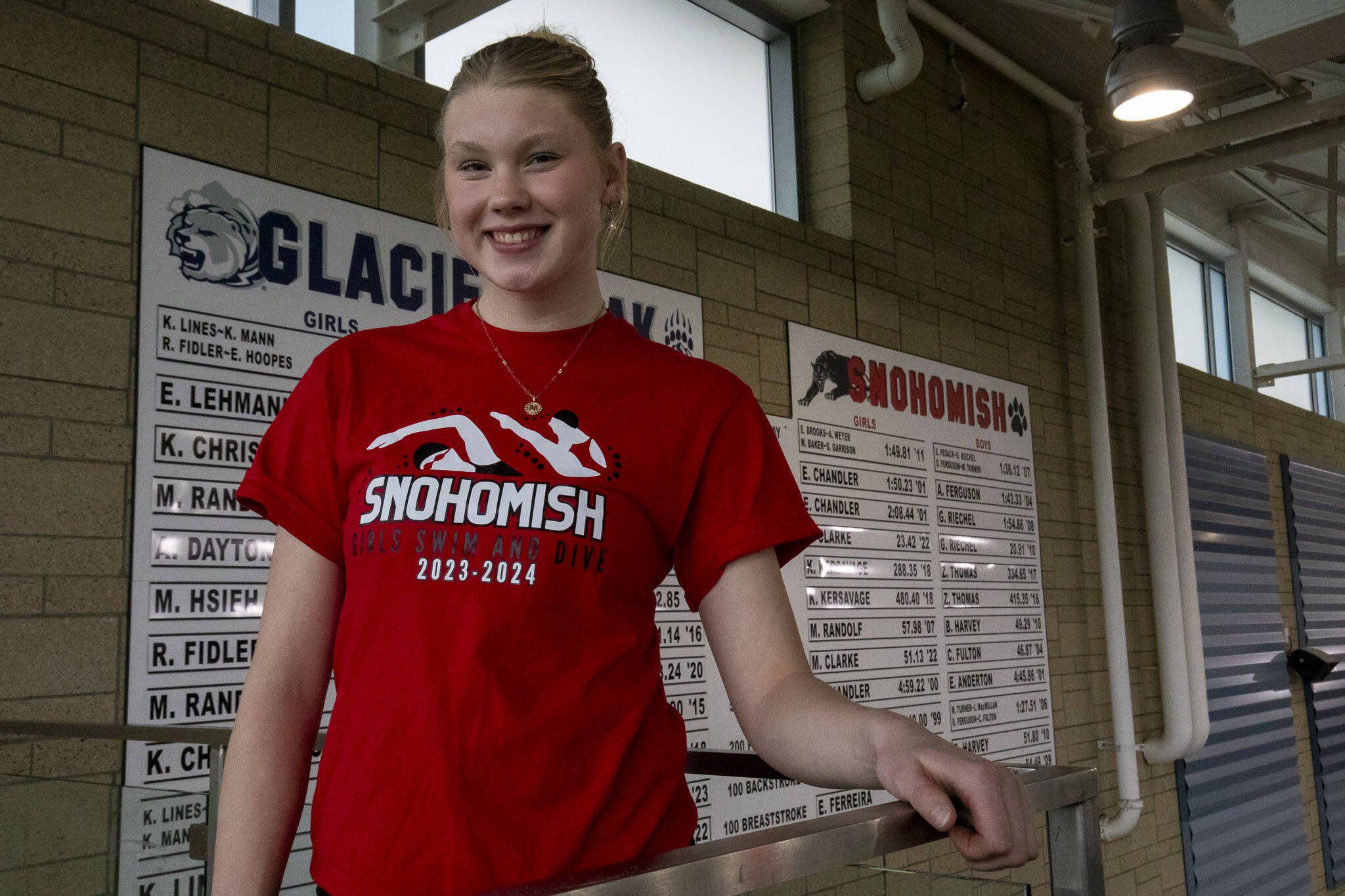 Record holder Snohomish swimmer Mary Clark poses for a photo at the Snohomish Aquatic Center in Snohomish, Washington on Monday, Oct. 23, 2023. (Annie Barker / The Herald)