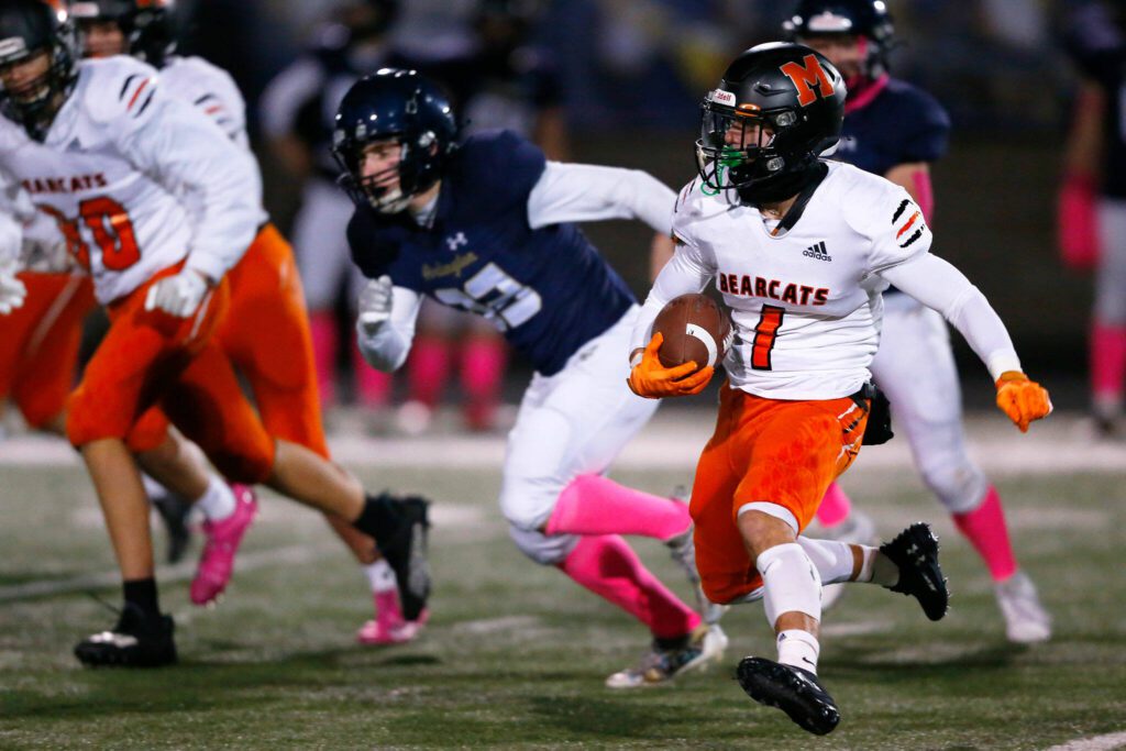 Monroe’s Jack Irwin changes direction with the ball against Arlington on Friday, Oct. 27, 2023, at Arlington High School in Arlington, Washington. (Ryan Berry / The Herald)

