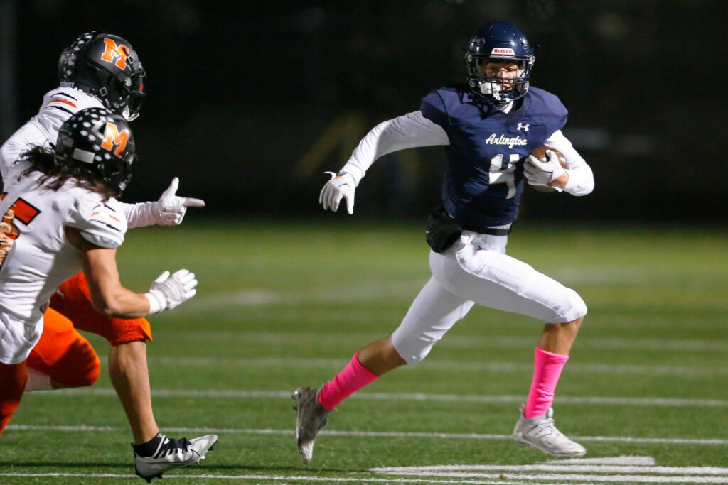 Arlington junior Jake Willis takes a kickoff for a solid return against Monroe on Friday, Oct. 27, 2023, at Arlington High School in Arlington, Washington. (Ryan Berry / The Herald)
