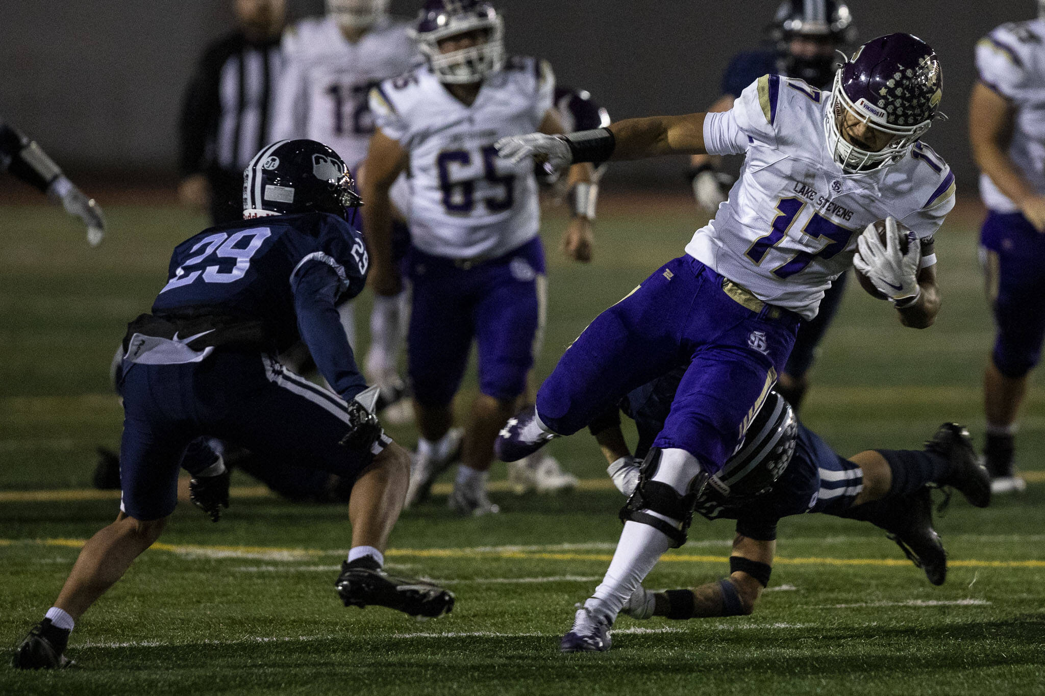 Lake Stevens’ Jayshon Limar (17) runs with the ball during a game between Glacier Peak and Lake Stevens at Veterans Memorial Stadium in Snohomish, Washington on Friday, Oct. 27, 2023. Lake Stevens won, 42-7. (Annie Barker / The Herald)