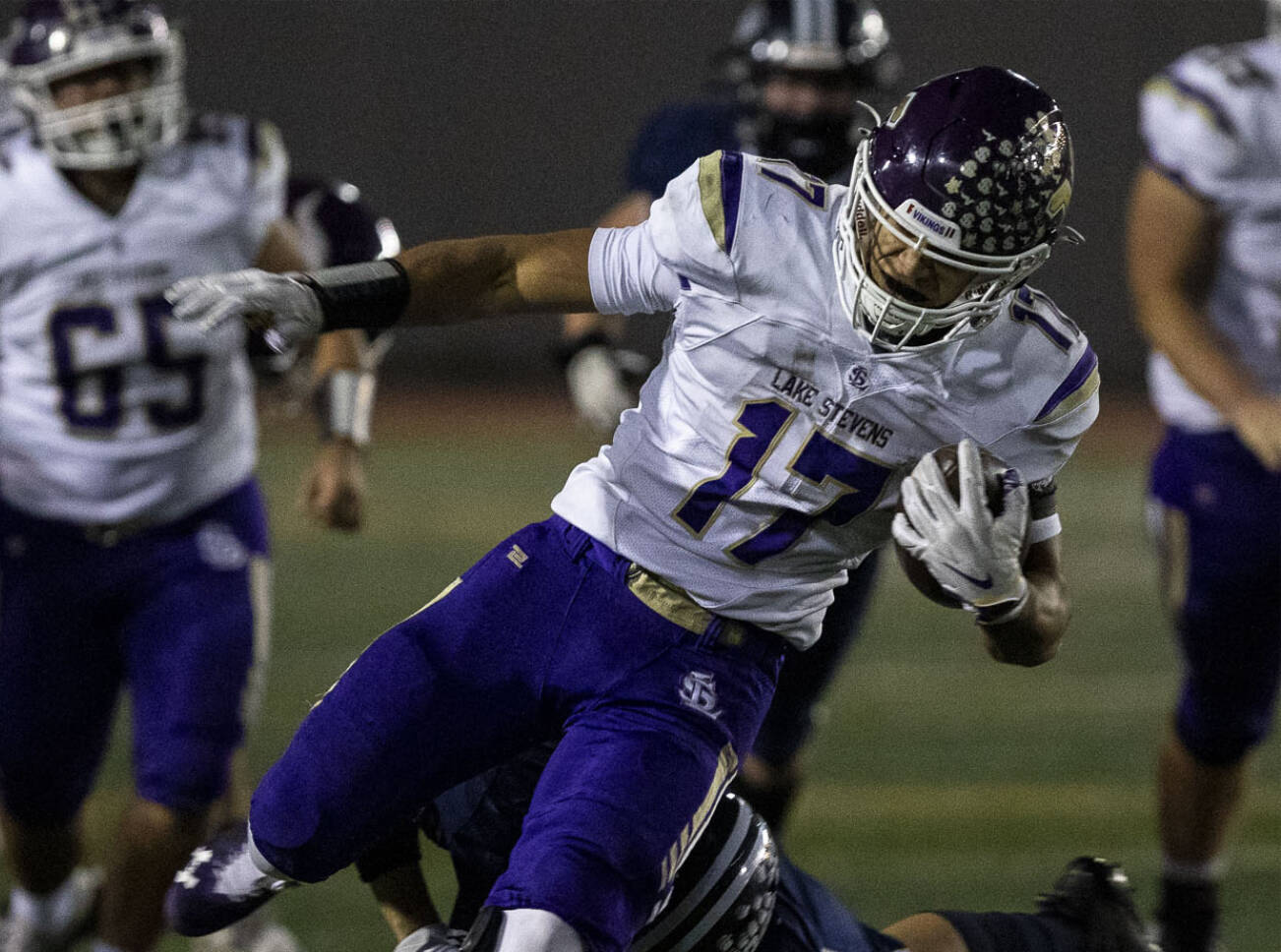 Lake Stevens’ Jayshon Limar (17) runs with the ball during a game between Glacier Peak and Lake Stevens at Veterans Memorial Stadium in Snohomish, Washington on Friday, Oct. 27, 2023. Lake Stevens won, 42-7. (Annie Barker / The Herald)