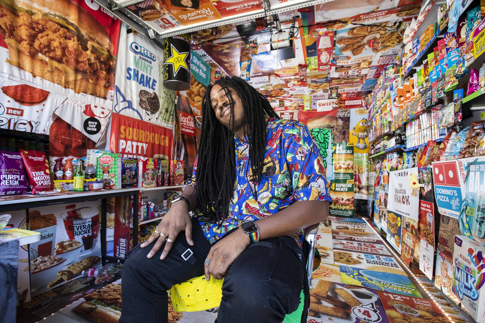 Jaxen McInnis, 26, the creator of the Snackin Shack, in his transformed alley garage in downtown Everett. (Olivia Vanni / The Herald)