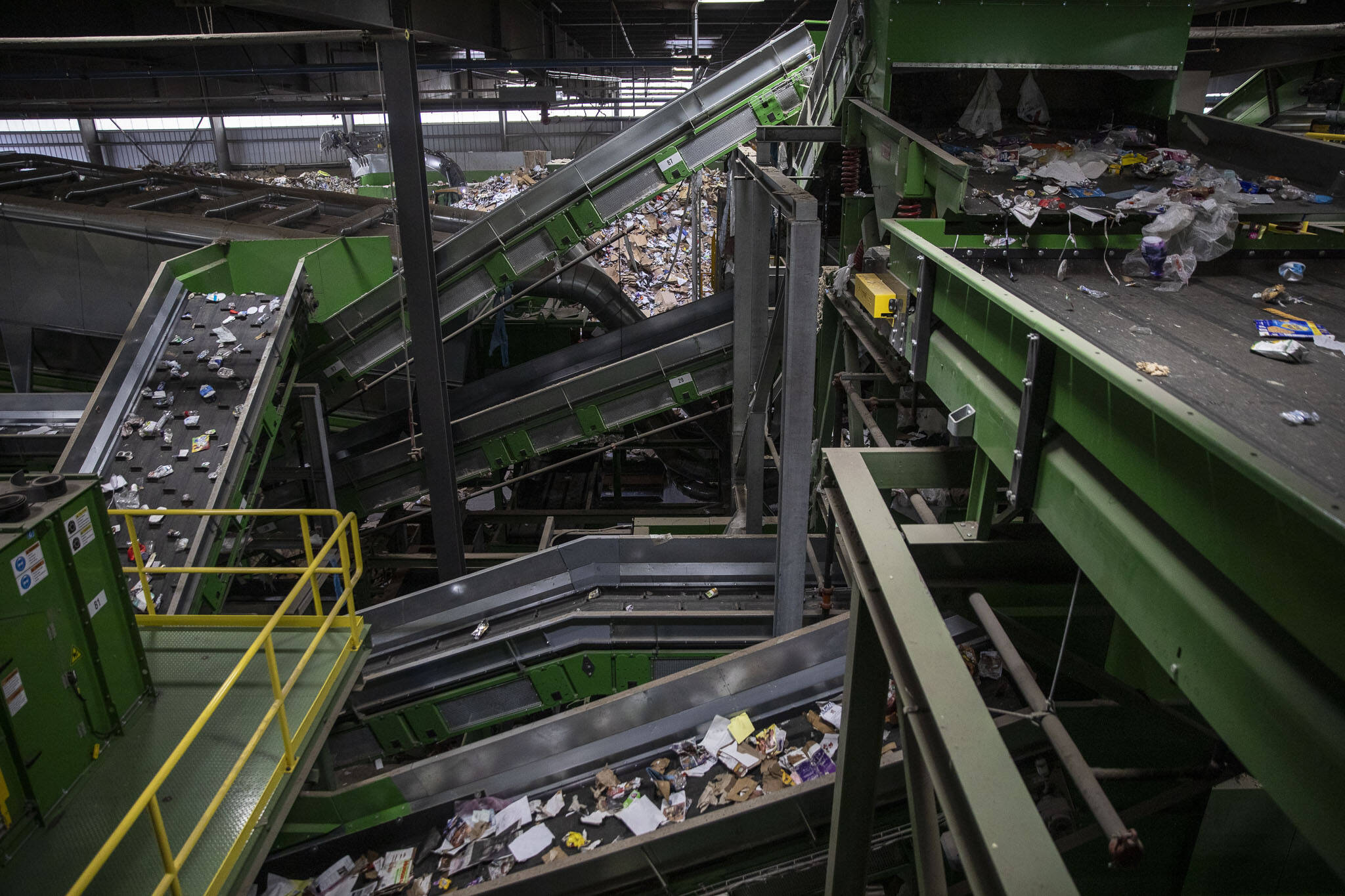 Items are sorted for recycling inside the Waste Management Cascade Recycling Center in Woodinville, Washington on Wednesday, Nov. 1, 2023. (Annie Barker / The Herald)