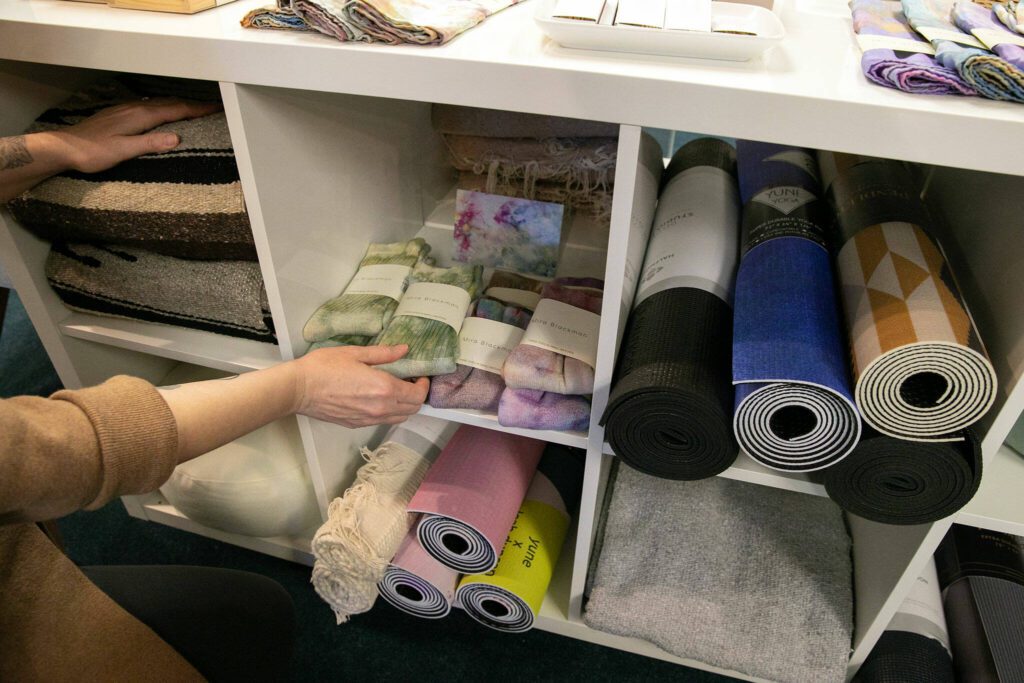 Socks, blankets, yoga mats and more are available at East West Books & Gifts on Friday, Oct. 27, 2023, in Edmonds, Washington. (Ryan Berry / The Herald)
