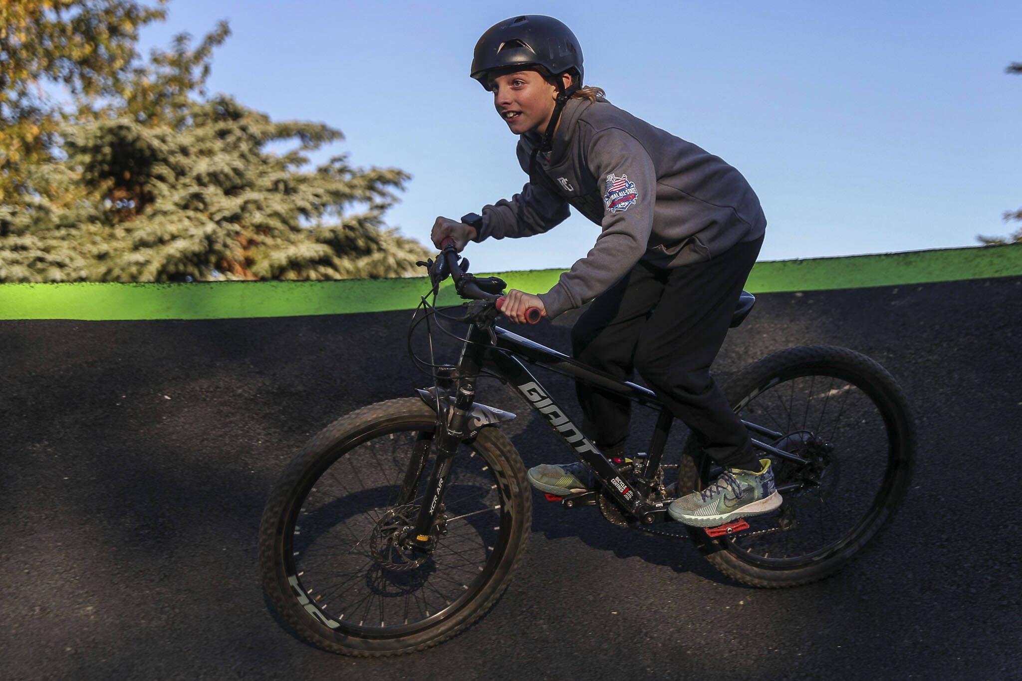 Landon Oliphant, 10, rides a new pump track for bikes at Jennings Nature Park in Marysville. (Annie Barker / The Herald)