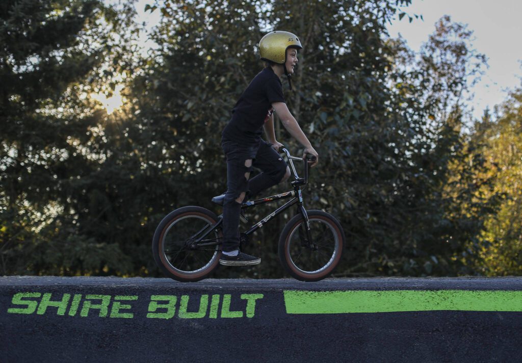 Abel Grant, 10, rides a new pump track for bikes at Jennings Nature Park in Marysville. (Annie Barker / The Herald)
