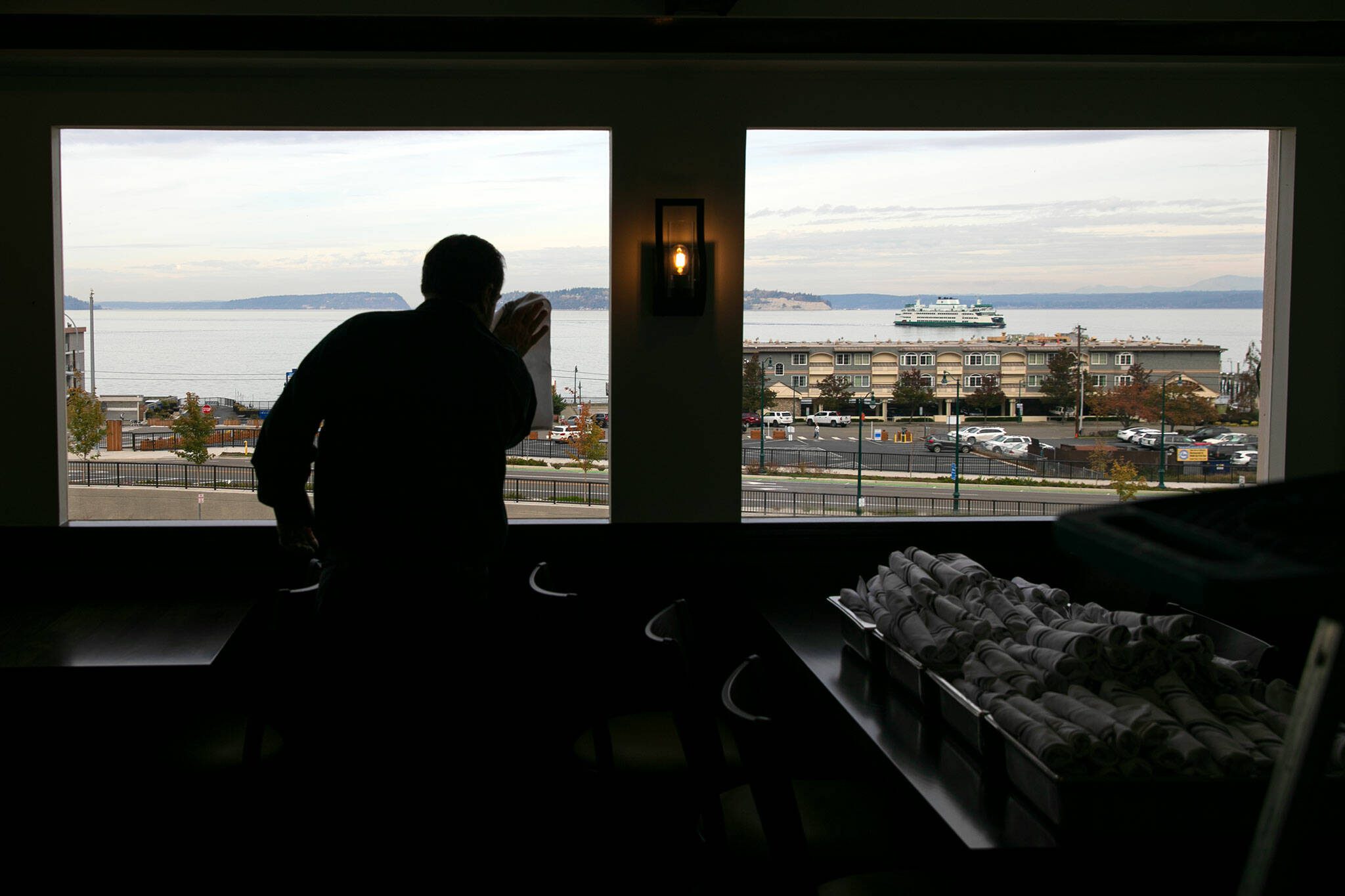 Staff meticulously clean the dining room at Hook & Cleaver on Wednesday, Nov. 1, 2023, in Mukilteo, Washington. (Ryan Berry / The Herald)