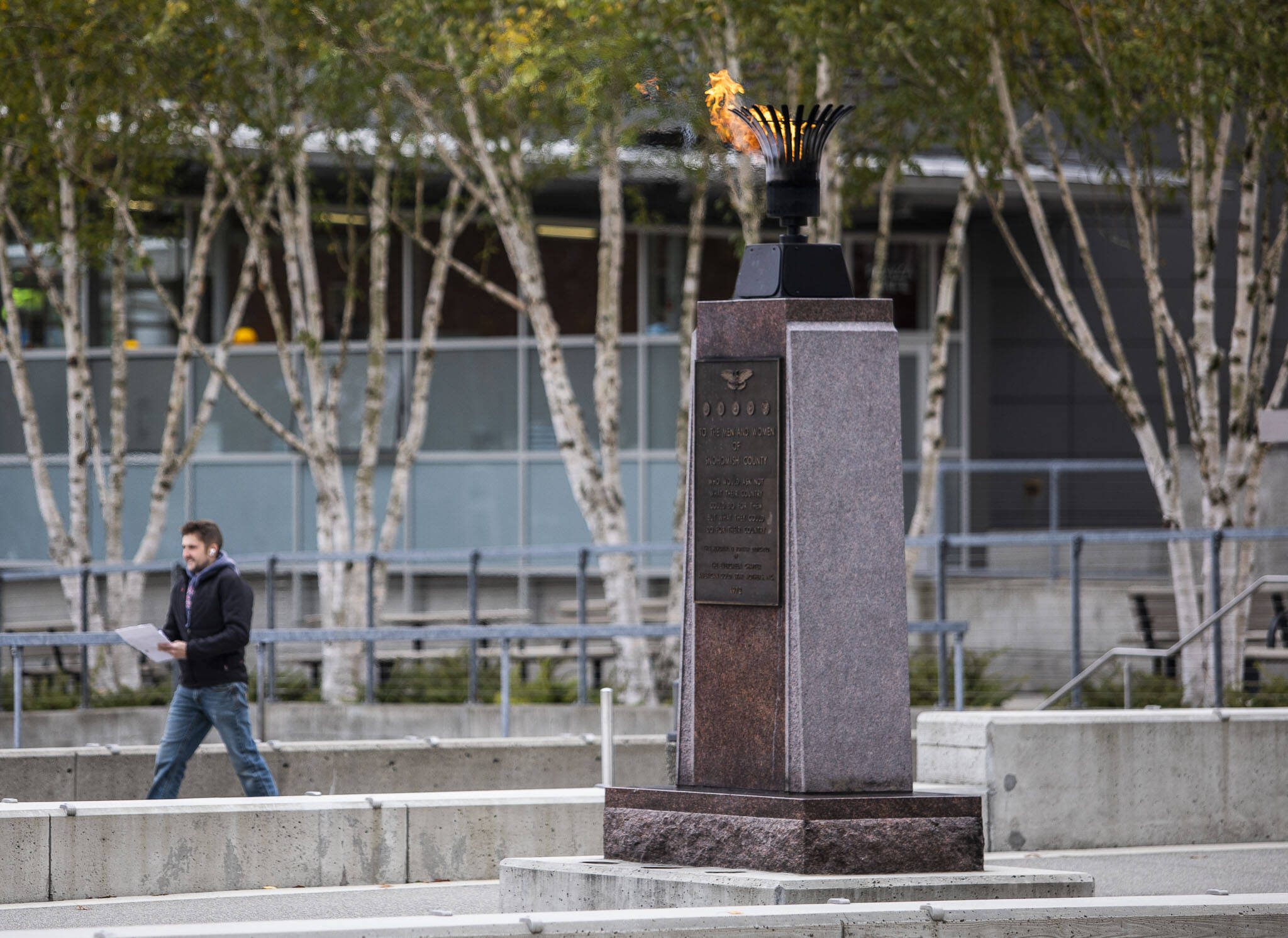 The Eternal Flame monument burns in the center of the Snohomish County Campus on Thursday, Nov. 3, 2022 in Everett, Washington. (Olivia Vanni / The Herald)