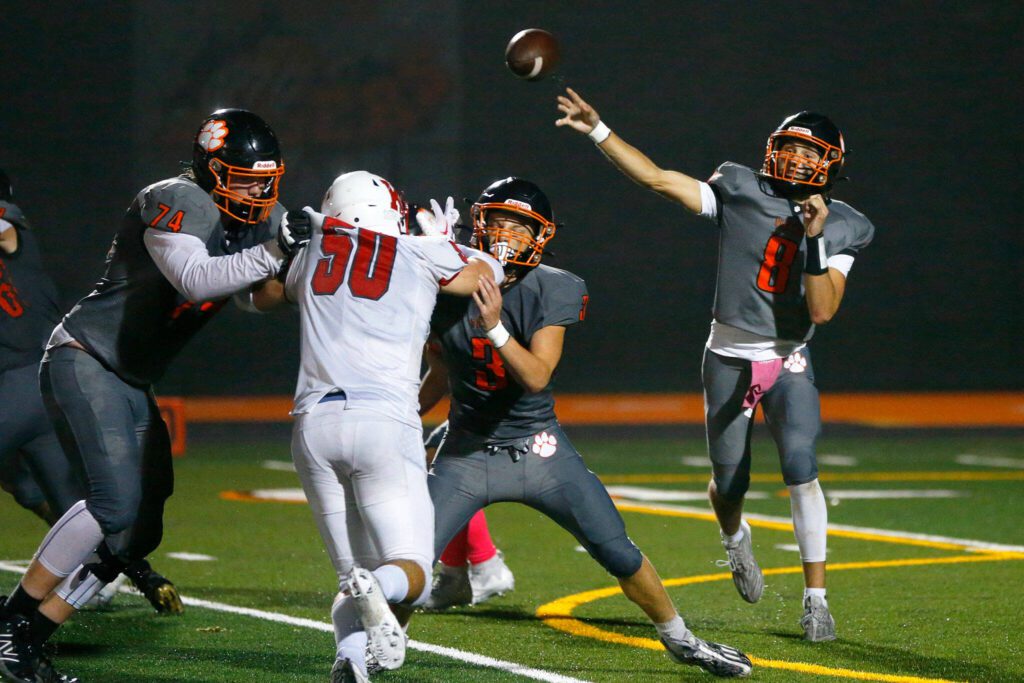 Granite Falls quarterback Kaden LaPlaunt throws a short pass to the against King’s on Oct. 19 in Granite Falls. (Ryan Berry / The Herald)
