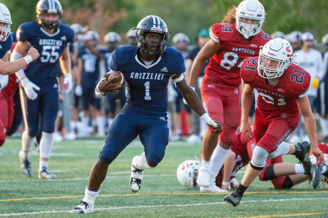 Glacier Peak's Çhrisvin Bonshe (1) finds space while running with the ball against Snohomish on Sept. 1, 2023, at Veterans Memorial Stadium in Snohomish. (John Gardner / Pro Action Image)