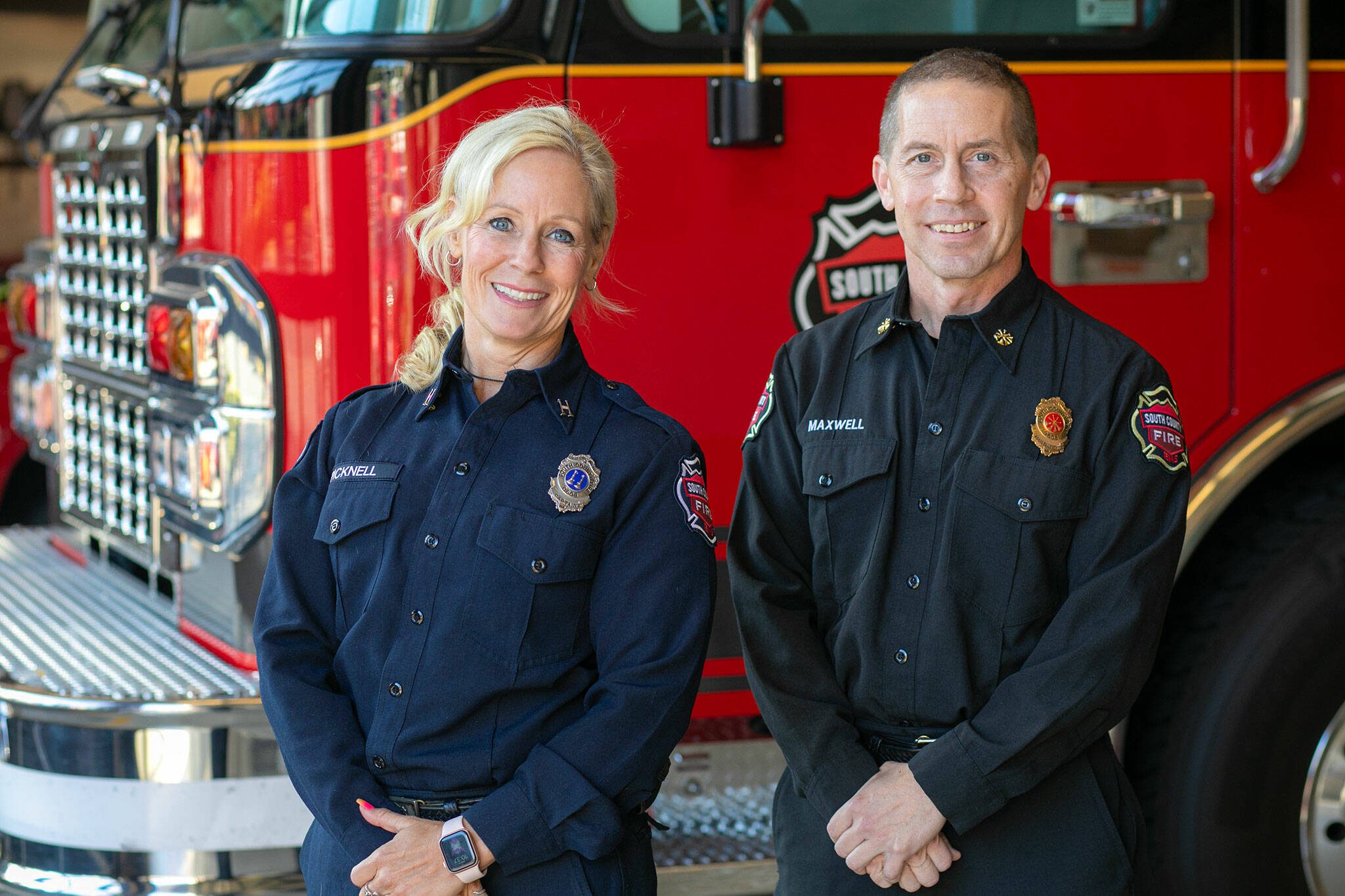 Captain Community Resource Paramedic Nicole Picknell, left, and South County Fire Assistant Chief Shaughn Maxwell stand together at Fire Station 15 on Wednesday, Nov. 8, 2023, in Lynnwood, Washington. (Ryan Berry / The Herald)