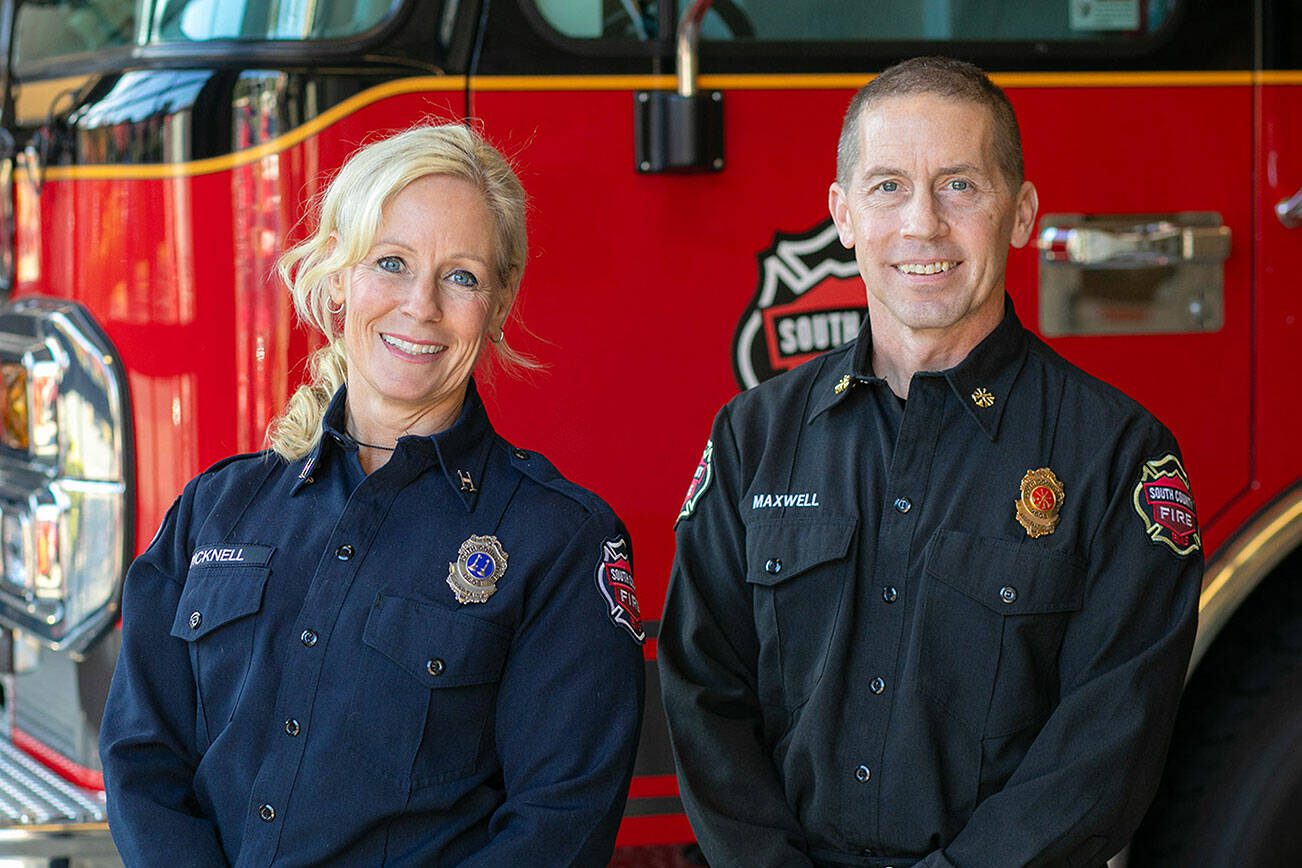Captain Community Resource Paramedic Nicole Picknell, left, and South County Fire Assistant Chief Shaughn Maxwell stand together at Fire Station 15 on Wednesday, Nov. 8, 2023, in Lynnwood, Washington. (Ryan Berry / The Herald)