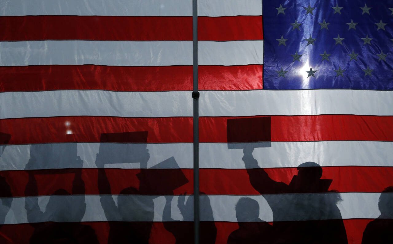 People cheer as then-Democratic presidential candidate Sen. Bernie Sanders, I-Vt., speaks at a campaign rally in Sioux City, Iowa in January 2020. (John Locher/ Associated Press file photo)