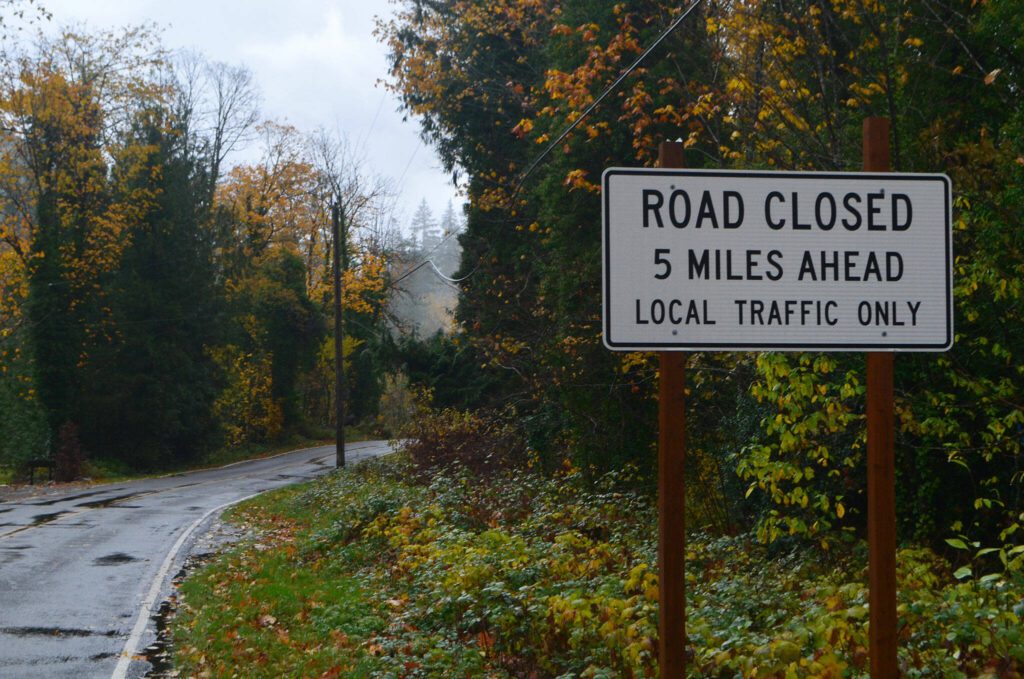 A sign stating the road is closed five miles ahead on Index-Galena Road, pictured here on Saturday, Nov. 4, 2023, near Index, Washington, will soon be removed. The road is now open. (Jordan Hansen / The Herald)
