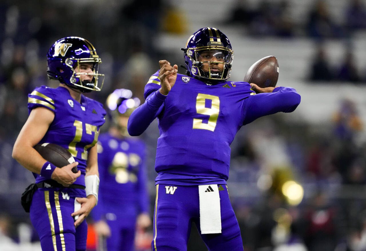 Washington quarterback Michael Penix Jr. (9) warms up before a game against Arizona State on Oct. 21 in Seattle. (AP Photo/Lindsey Wasson)