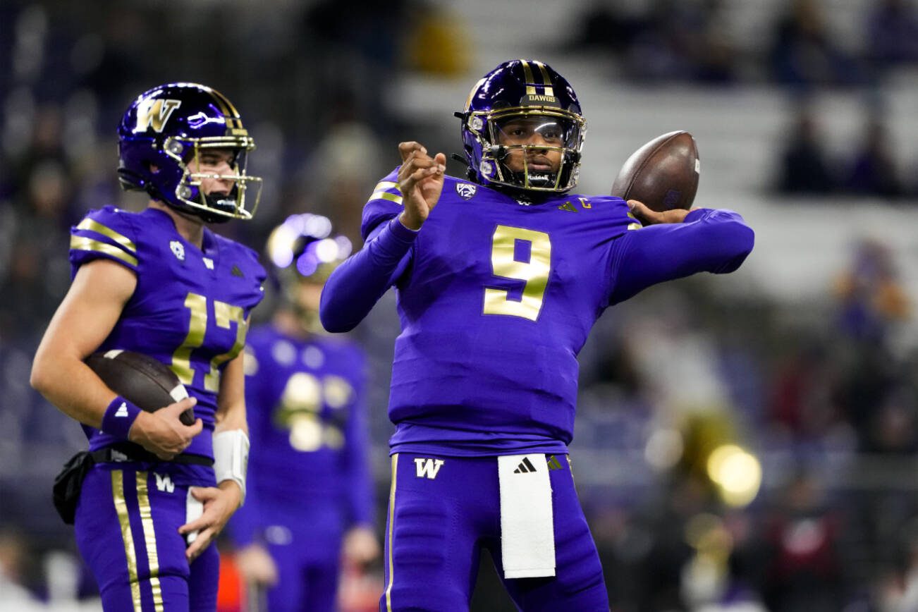 Washington quarterback Michael Penix Jr. (9) warms up before an NCAA college football game against Arizona State, Saturday, Oct. 21, 2023, in Seattle. (AP Photo/Lindsey Wasson)
