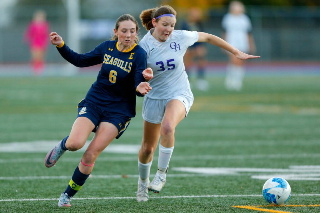 Everett’s Avery Marsall tries to fend off a defender during a district playoff matchup against Oak Harbor on Thursday, Nov. 2, 2023, at Shoreline Stadium in Shoreline, Washington. (Ryan Berry / The Herald)
