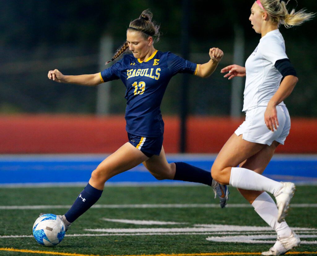 Everett midfielder Sienna Kuehn clears the ball from the box during a district playoff matchup against Oak Harbor on Thursday, Nov. 2, 2023, at Shoreline Stadium in Shoreline, Washington. (Ryan Berry / The Herald)
