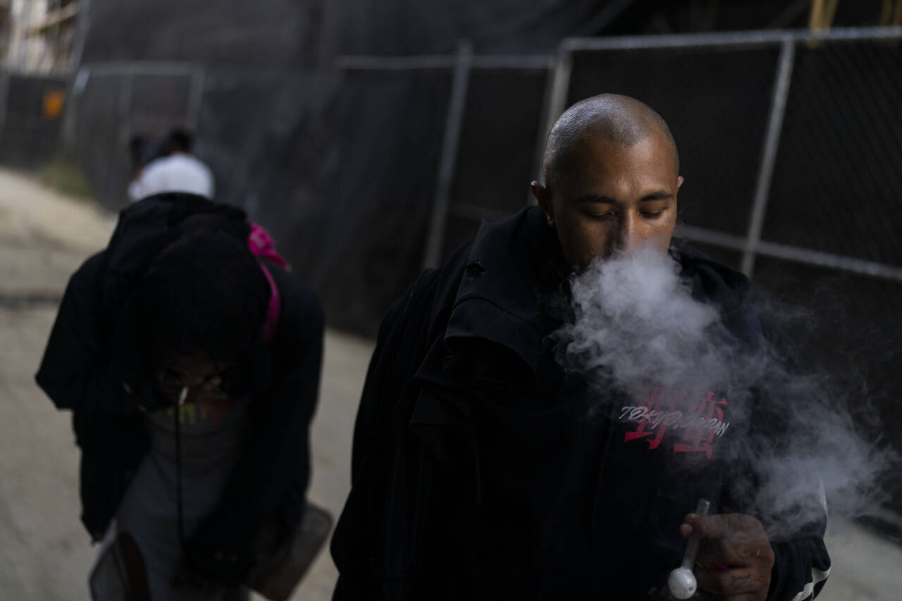 Armando Rivera, 33, smokes fentanyl mixed with methamphetamine in an alley in Los Angeles, in August, 2022. Use of fentanyl, a powerful synthetic opioid that is cheap to produce and is often sold as is or laced in other drugs, has exploded. Because it’s 50 times more potent than heroin, even a small dose can be fatal. It has quickly become the deadliest drug in the nation, according to the Drug Enforcement Administration. (Jae C. Hong / Associated Press)