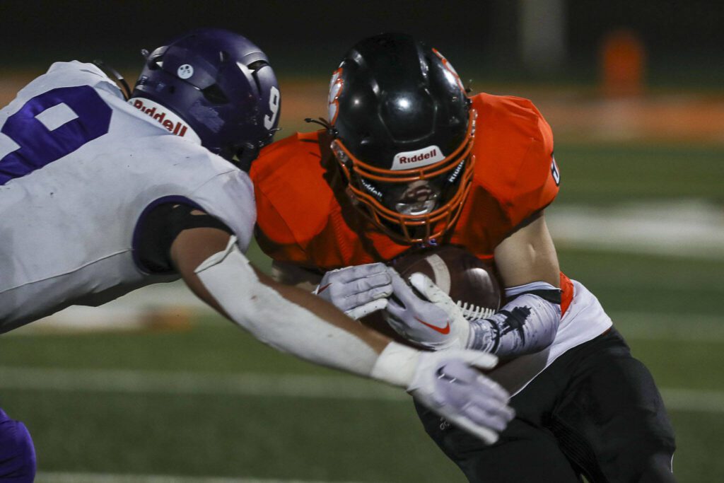 Nooksack Valley’s Colton Lentz (9) tackles during a game between Granite Falls and Nooksack Valley at Granite Falls High School in Granite Falls, Washington on Friday, Nov. 3, 2023. Nooksack Valley won, 56-0. (Annie Barker / The Herald)
