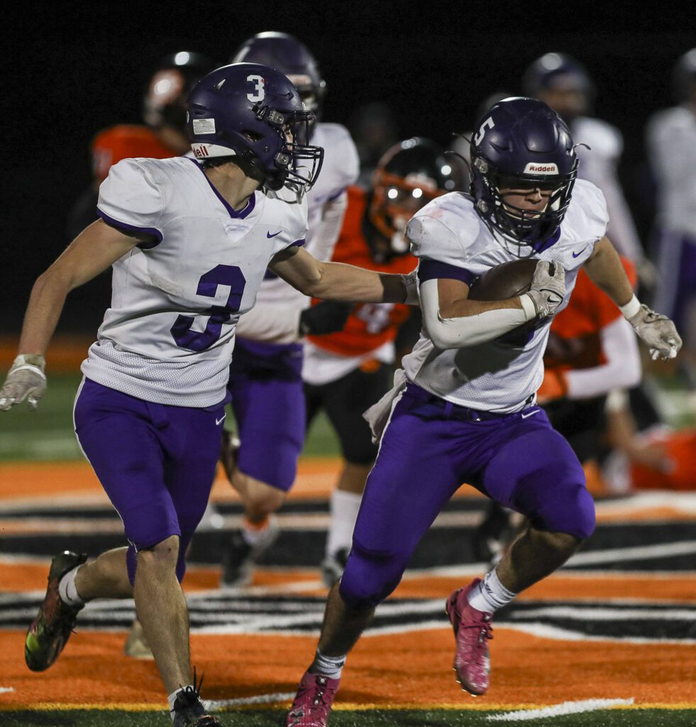 Nooksack Valley’s Skyler Whittern (5) runs with the ball during a game between Granite Falls and Nooksack Valley at Granite Falls High School in Granite Falls, Washington on Friday, Nov. 3, 2023. Nooksack Valley won, 56-0. (Annie Barker / The Herald)

