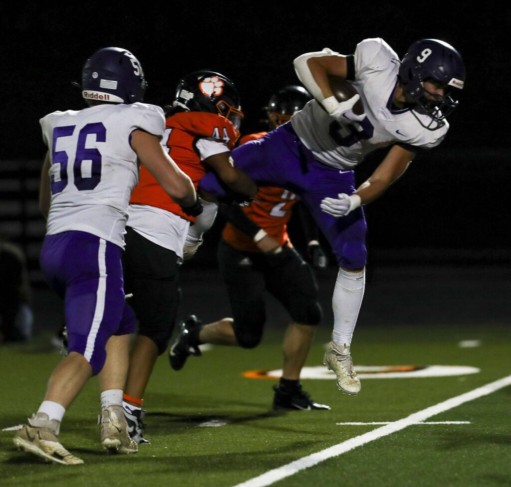 Nooksack Valley’s Colton Lentz (9) runs with the ball during a game between Granite Falls and Nooksack Valley at Granite Falls High School in Granite Falls, Washington on Friday, Nov. 3, 2023. Nooksack Valley won, 56-0. (Annie Barker / The Herald)
