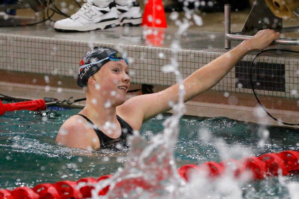 Mary Clarke of Snohomish turns to her look for coaches after handily winning the 100 yard freestyle during the Wesco 3A Division 1 Girls Swim and Dive Finals on Saturday, Nov. 4, 2023, at the Snohomish Aquatic Center in Snohomish, Washington. (Ryan Berry / The Herald)
