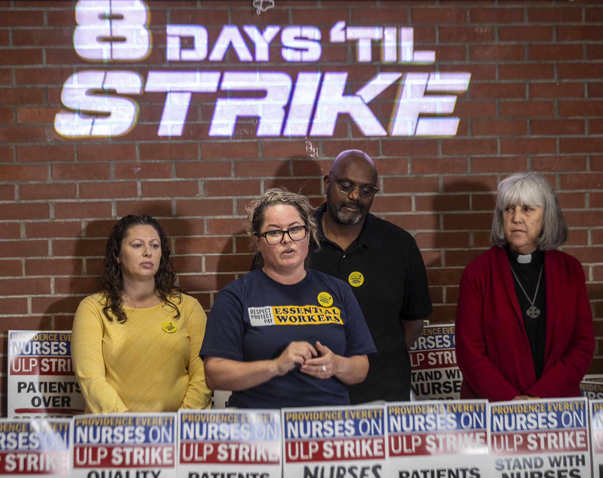 nurses speak at a press conference