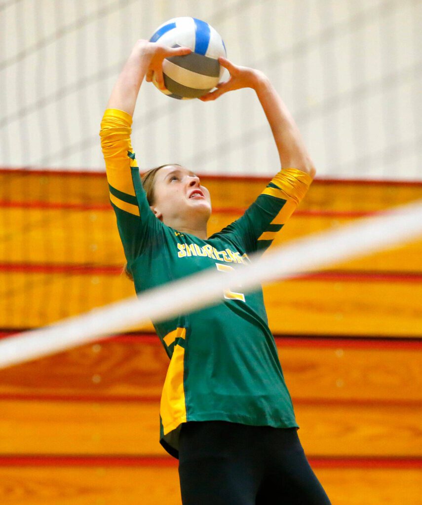 Shorecrest’s Violet Burchak sets the ball during a Wesco 3A District volleyball matchup against Lynnwood on Thursday, Nov. 9, 2023, at Marysville Pilchuck High School in Marysville, Washington. (Ryan Berry / The Herald)
