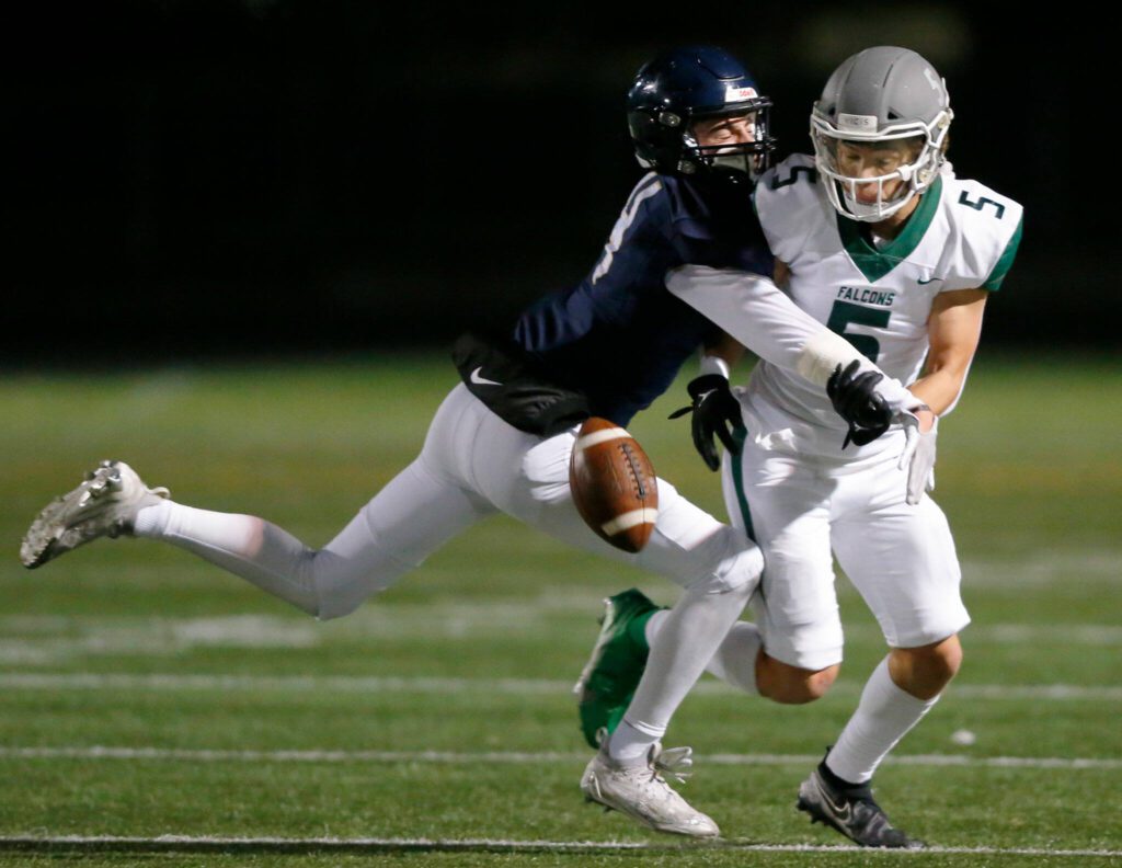 Arlington junior Jake Willis forces an incompletion against Ridgeline during a playoff matchup Friday, Nov. 10, 2023, at Arlington High School in Arlington, Washington. (Ryan Berry / The Herald)
