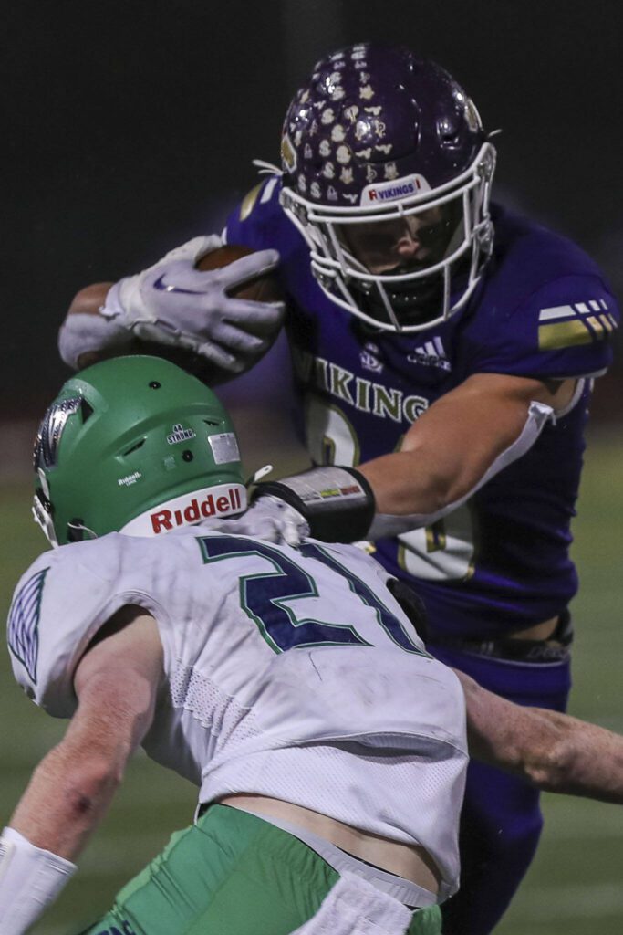 Lake Stevens’ Keagan Howard (80) moves with the ball during a football game between Lake Stevens and Woodinville at Lake Stevens High School in Lake Stevens, Washington on Friday, Nov. 10, 2023. Lake Stevens won, 41-0. (Annie Barker / The Herald)
