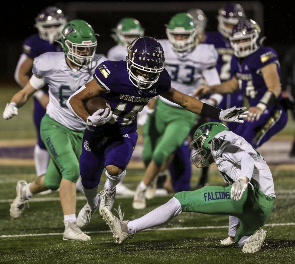 Lake Stevens’ Talha Rai (18) moves with the ball during a football game between Lake Stevens and Woodinville at Lake Stevens High School in Lake Stevens, Washington on Friday, Nov. 10, 2023. Lake Stevens won, 41-0. (Annie Barker / The Herald)