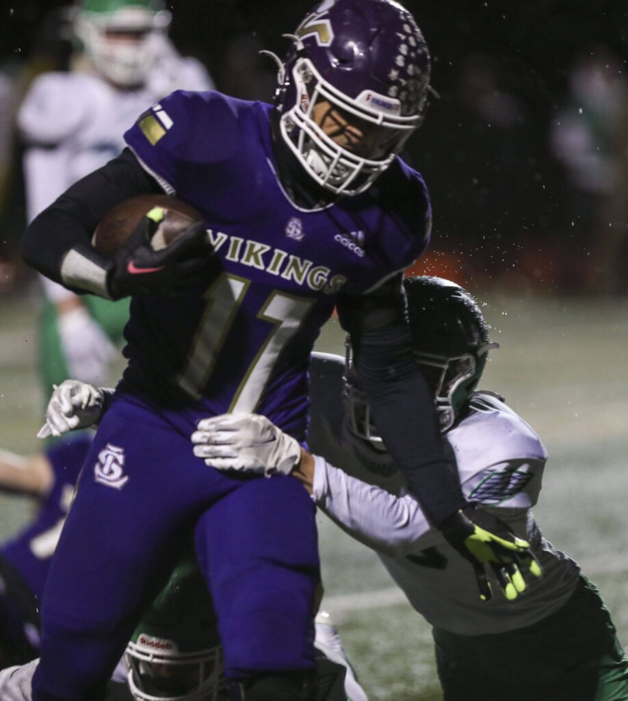 Lake Stevens’ Jayshon Limar (17) moves with the ball during a football game between Lake Stevens and Woodinville at Lake Stevens High School in Lake Stevens, Washington on Friday, Nov. 10, 2023. Lake Stevens won, 41-0. (Annie Barker / The Herald)