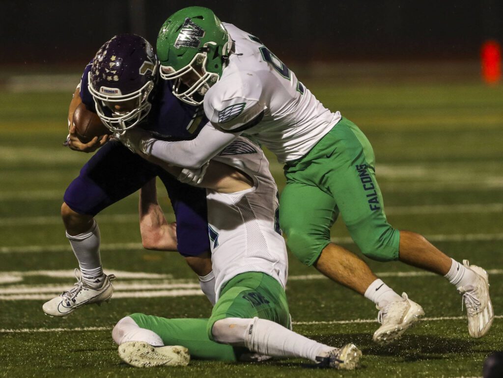 Lake Stevens’ Paul Varela (9) moves with the ball during a football game between Lake Stevens and Woodinville at Lake Stevens High School in Lake Stevens, Washington on Friday, Nov. 10, 2023. Lake Stevens won, 41-0. (Annie Barker / The Herald)