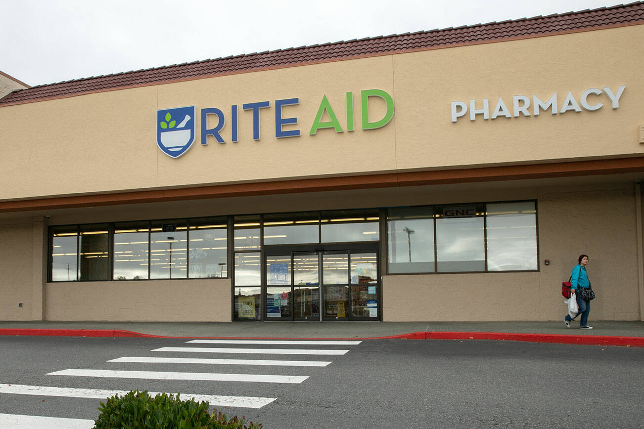 Customers come and go at a soon-to-close Rite Aid on Evergreen Way on Friday, Oct. 19, 2023, in Everett, Washington. (Ryan Berry / The Herald)