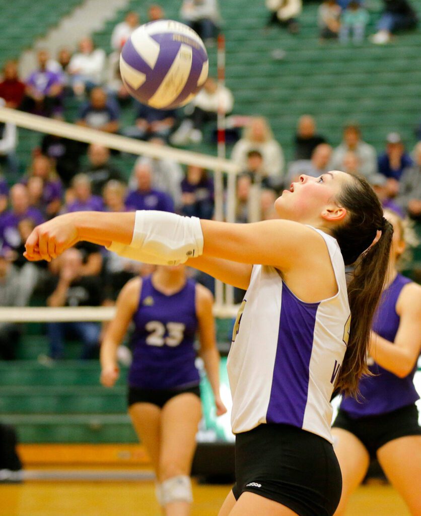 Lake Stevens libero Alyss Kelly bumps the ball towards the net against North Creek during the Wesco 4A district 1/2 championship match Saturday, Nov. 11, 2023, at Henry M. Jackson High School in Mill Creek, Washington. (Ryan Berry / The Herald)
